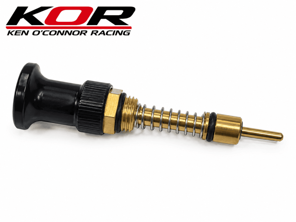 Yamaha Blaster VM26 choke assembly with black pull knob, brass-colored plunger, spring and sealing rings
