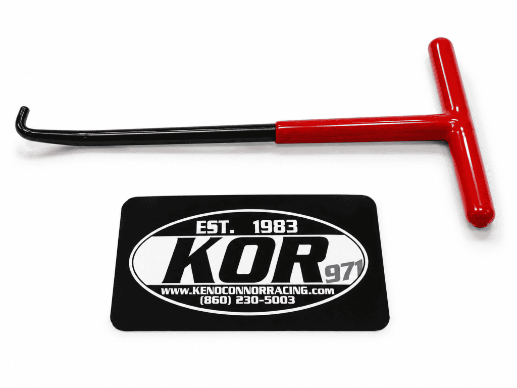 Exhaust spring hook with red T-handle and black hooked shaft on a white background with KOR logo
