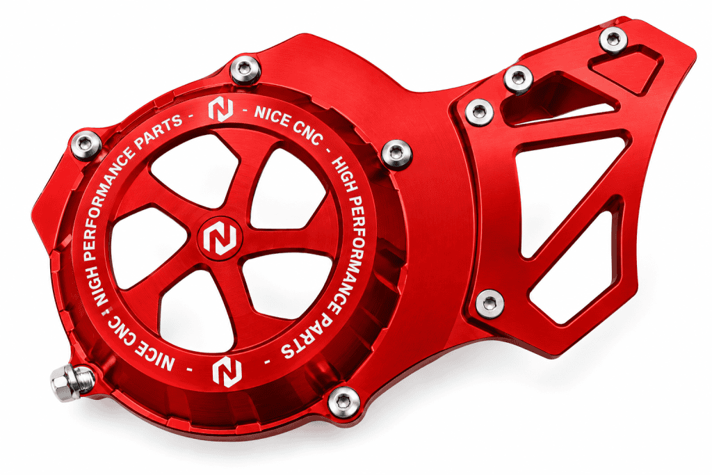 Red NICE CNC Yamaha Blaster flywheel cover with circular openings, a slotted extension and silver fasteners.