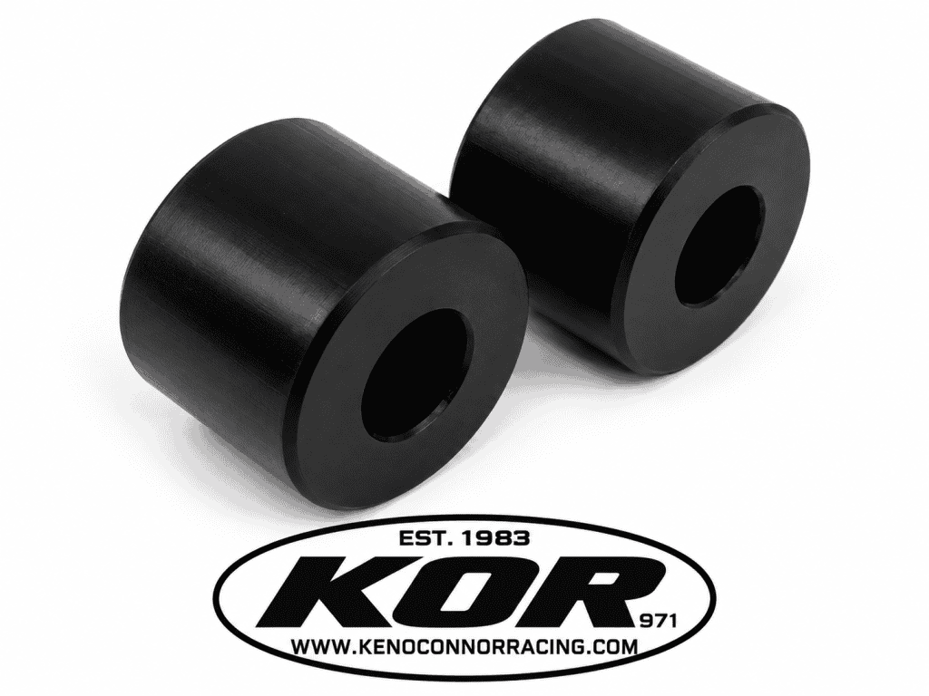 Two black Yamaha Blaster chain rollers with center mounting holes on a white background above the KOR logo.
