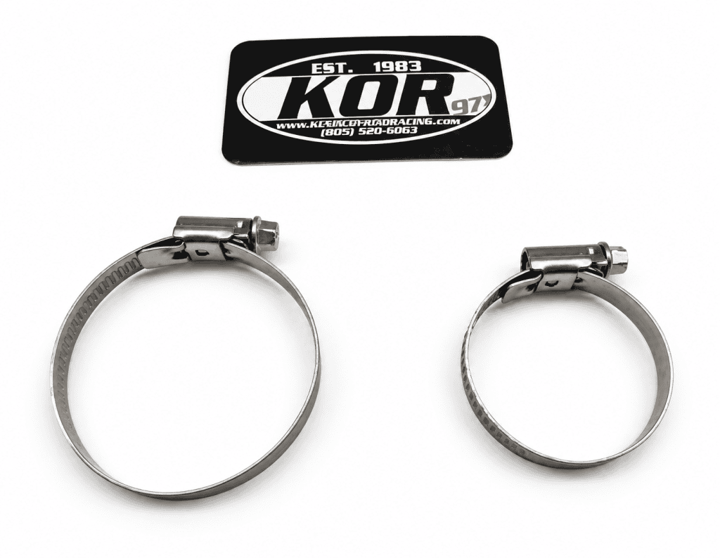 Two adjustable Yamaha Blaster 28mm PWK carburetor clamps on a white background below a KOR identification card.