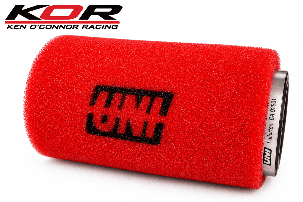 Red UNI two stage pod air filter with black UNI lettering and a metal mounting clamp on a white background